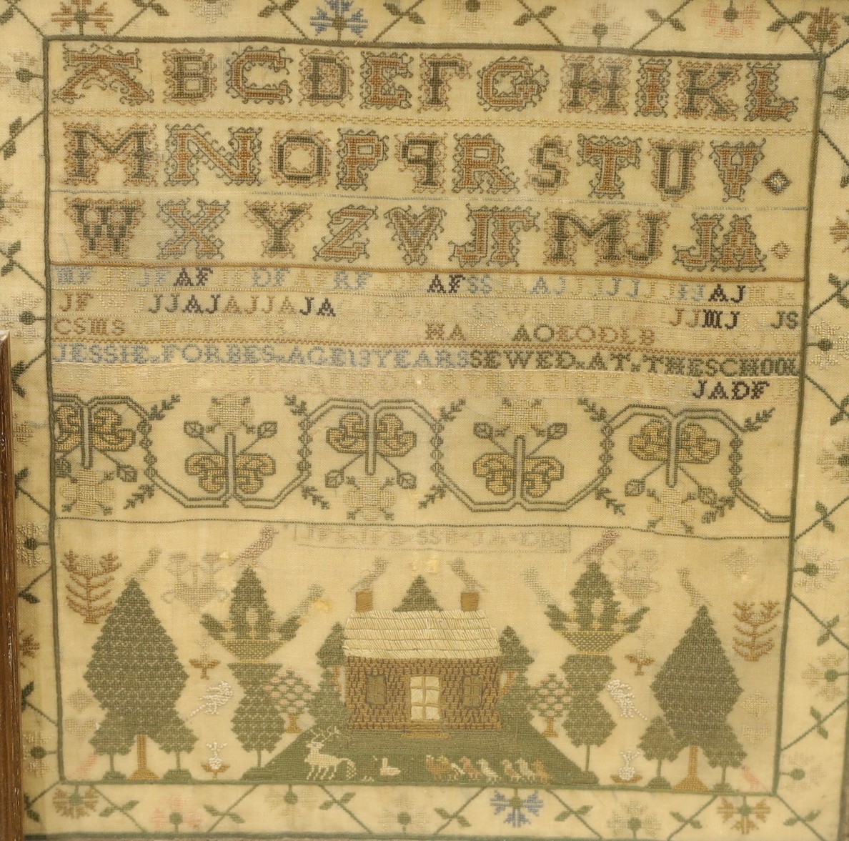 A 19th century cross stitch alphabet sampler, lower panel, depicting a house birds and trees, together with a later sampler-, 19th century sampler 33cms square.